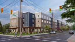 Expansive 4-story building located on the corner of the Central Ave & 29th Street intersection. People are walking around the building, evoking the sense of connection.