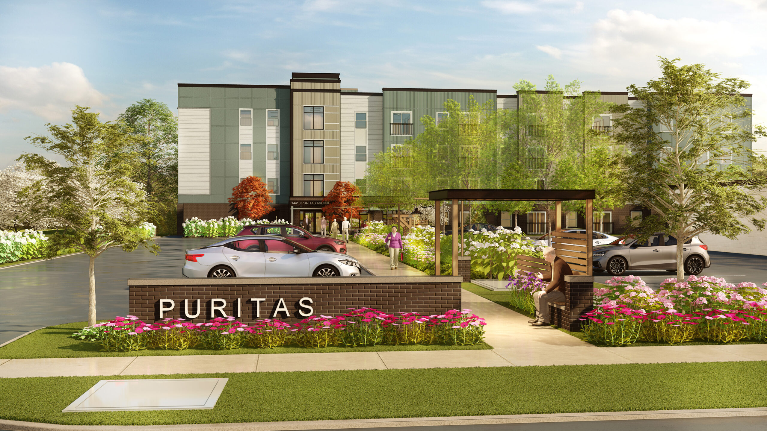 A photorealistic rendering of the Puritas Senior Living community building. A sitting area is located in the front which is along a sidewalk that connects the parking lot to the main building. A sign is at the front of the building with the name of the community: 